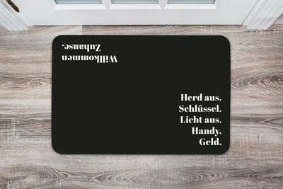 Bild: Fußmatte - Herd aus. Schlüssel. Licht aus. Handy. Geld. Geschenkidee