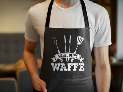 Kochschürze - Wähle Deine Waffe (Grillbesteck)
